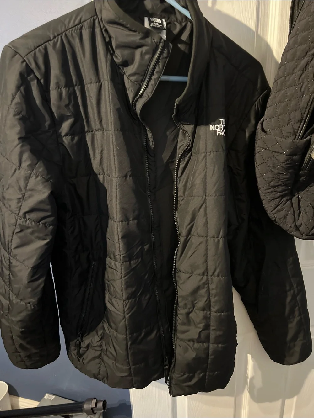 The North Face Black Jacket with white embroidered Tag Detail